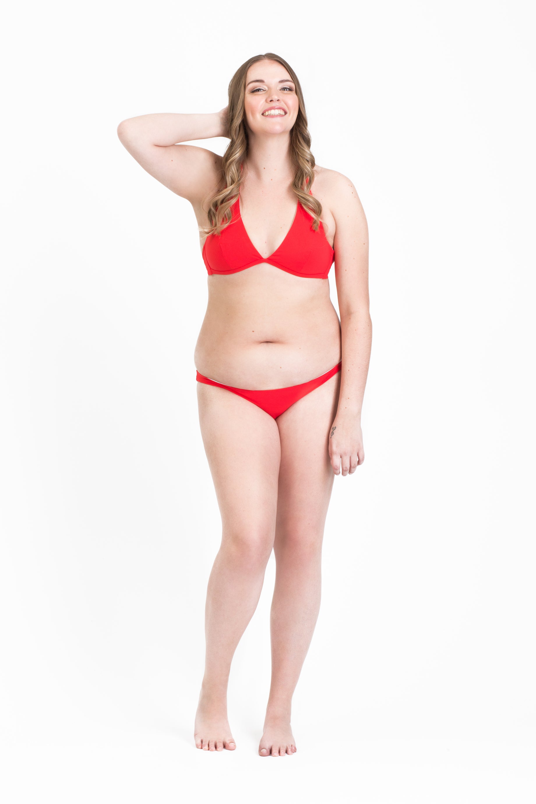 Coral red ISKKA Gabrielle Halter with low rise bottoms. Strike a pose!